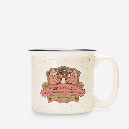 Speckled cream ceramic camp mug with whimsical mushroom and cat illustration, vintage text.