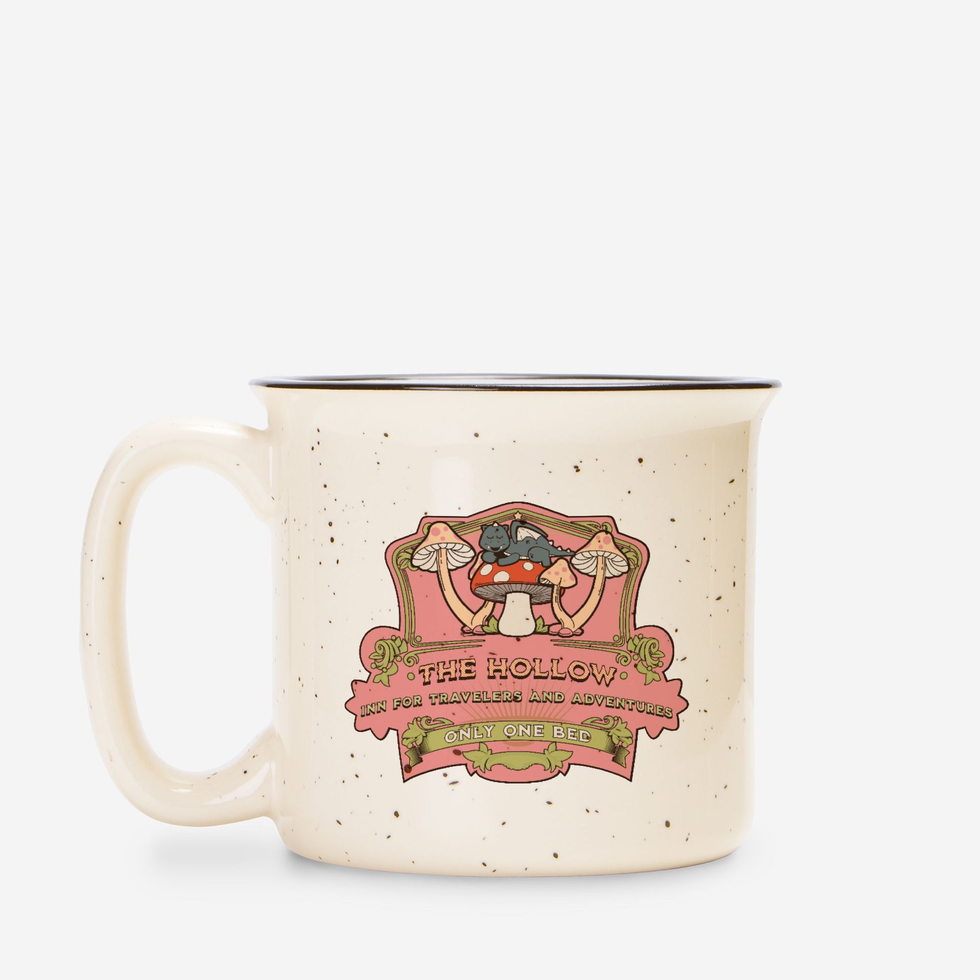 Speckled cream ceramic camp mug with whimsical mushroom and cat illustration, bookish design.