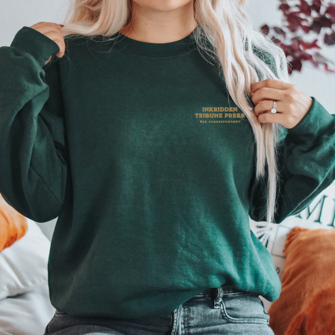 Dark green embroidered sweatshirt with bookish 'Inkridden Tribune Press' text, cozy reader apparel